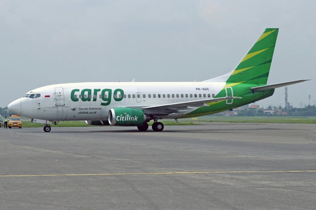 Citilink cargo airplane on a tarmac at an airport under an overcast sky.